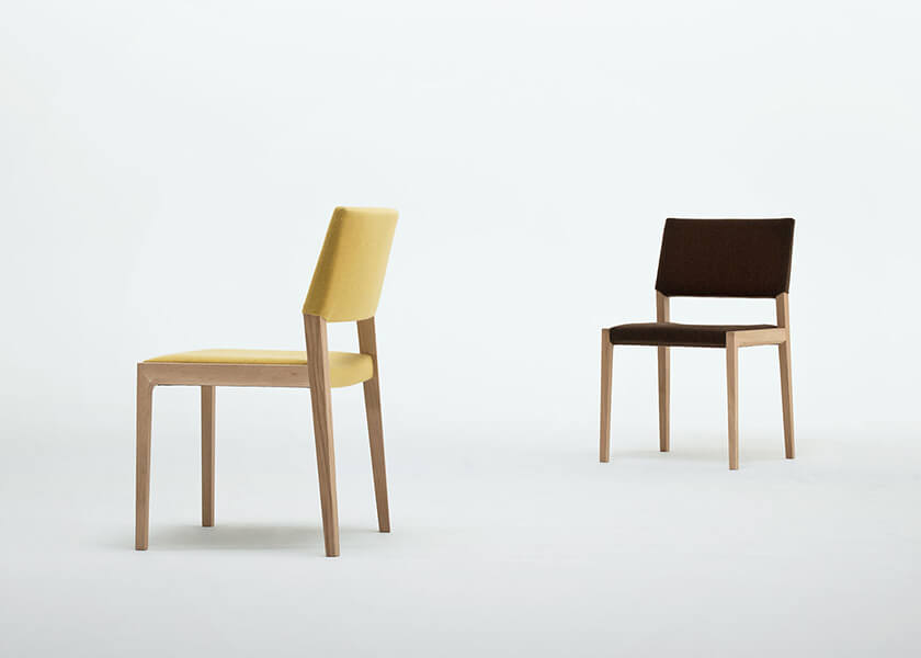 Chair with plastic legs and wood surface